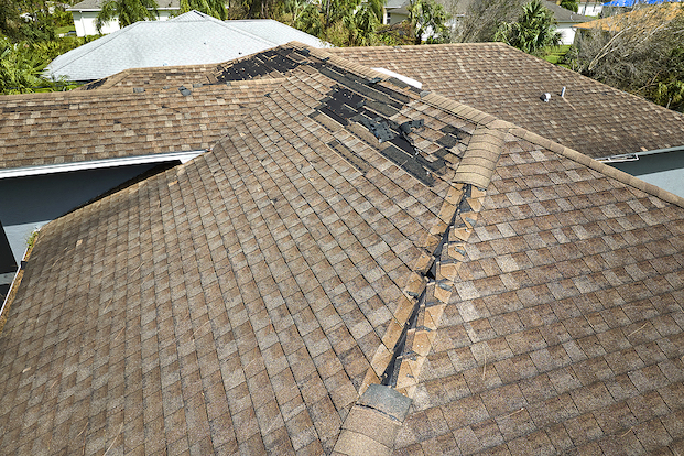 View of roof with shingles coming off