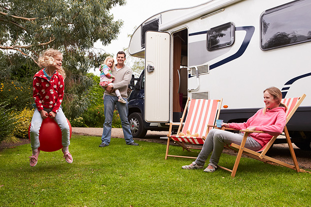 Family Enjoying Camping Holiday with Camper Van